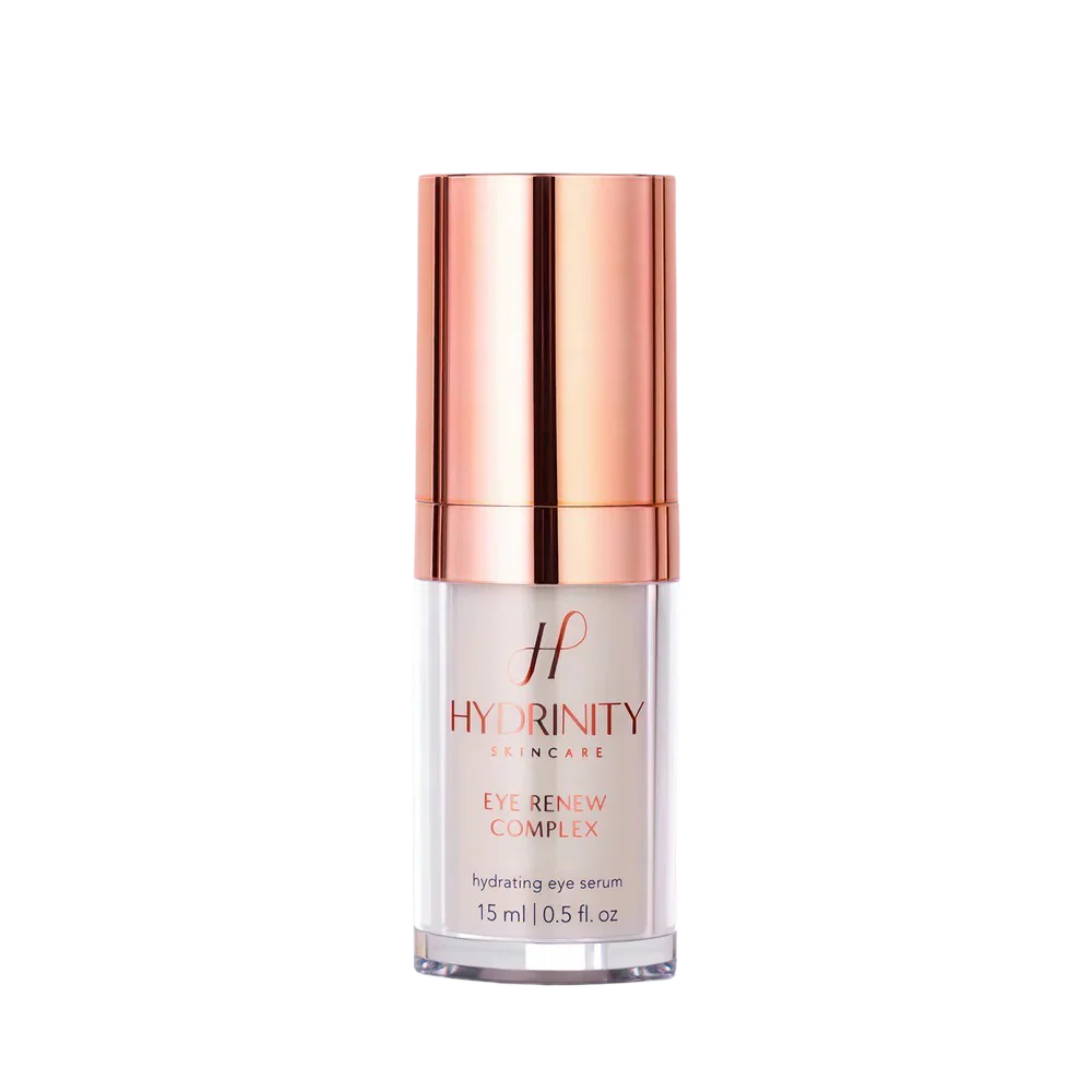 Skincare serum bottle with rose gold cap on a white background